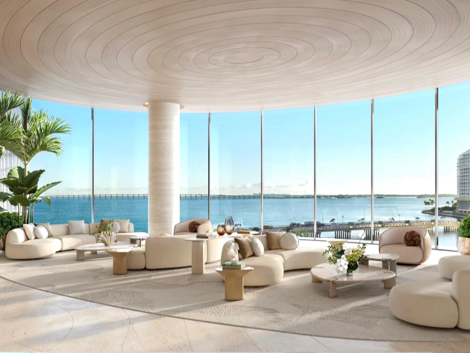 Light-filled waterfront lounge with curved furnishings